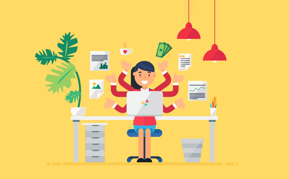 woman at a desk multitasking